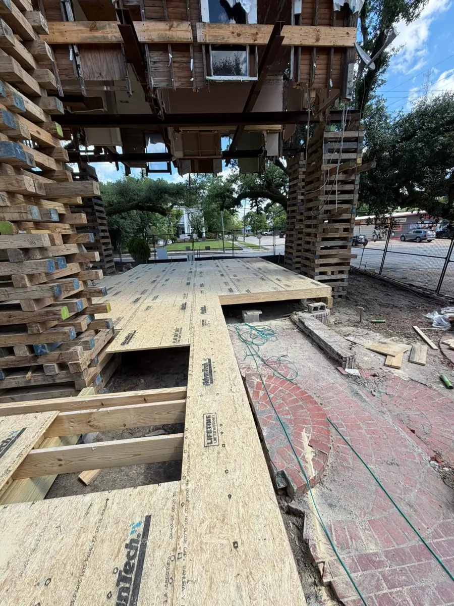 New floor framing and decking under a raised home